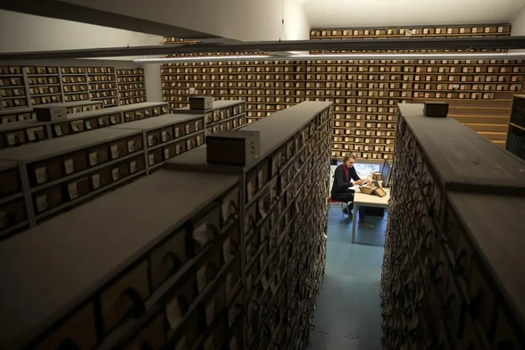 Encompasing photo inside the research room of the TLL showing 7 large floor to ceiling rows of shelving containing a portion of 10 million Latin vocabulary slips in boxes.