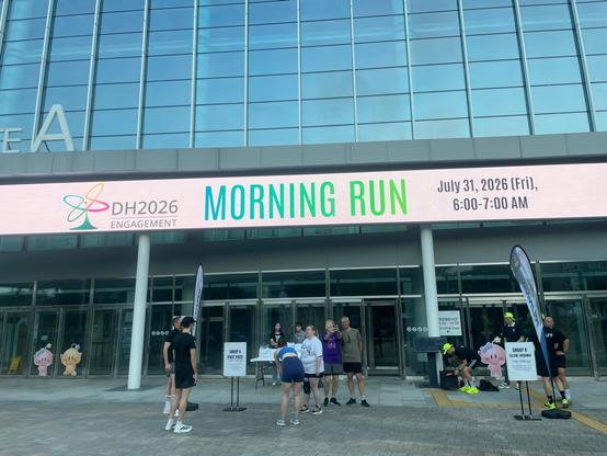 Big electronic sign on Daejeon Convention Centre saying 'DH2026 morning run'